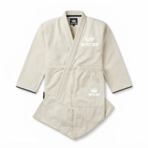 Folded neutral colored judo gi uniform set with jacket and trousers.