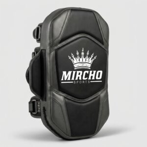 Black and gray punching shield with multiple handles for martial arts training.