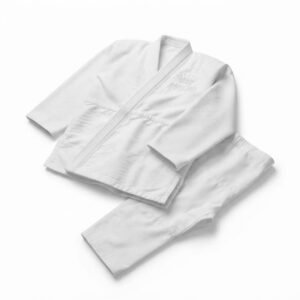 White judo uniform set laid flat against a clean background