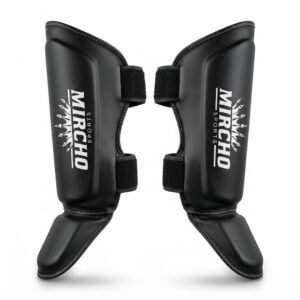 Pair of black synthetic leather forearm and shin guards featuring adjustable fastening straps.
