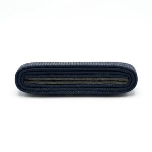 Folded dark navy martial arts belt displaying multi-row stitching on a white background.