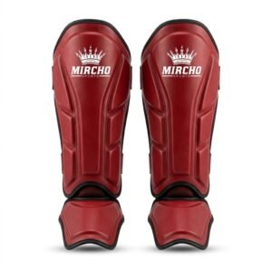 A pair of red martial arts shin and instep guards with black trim and dual straps.