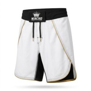 White MMA grappling shorts featuring a black waistband, black inseam panels, and gold piping trim.