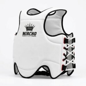 White martial arts torso protector with black trim and back lacing displayed in a studio.